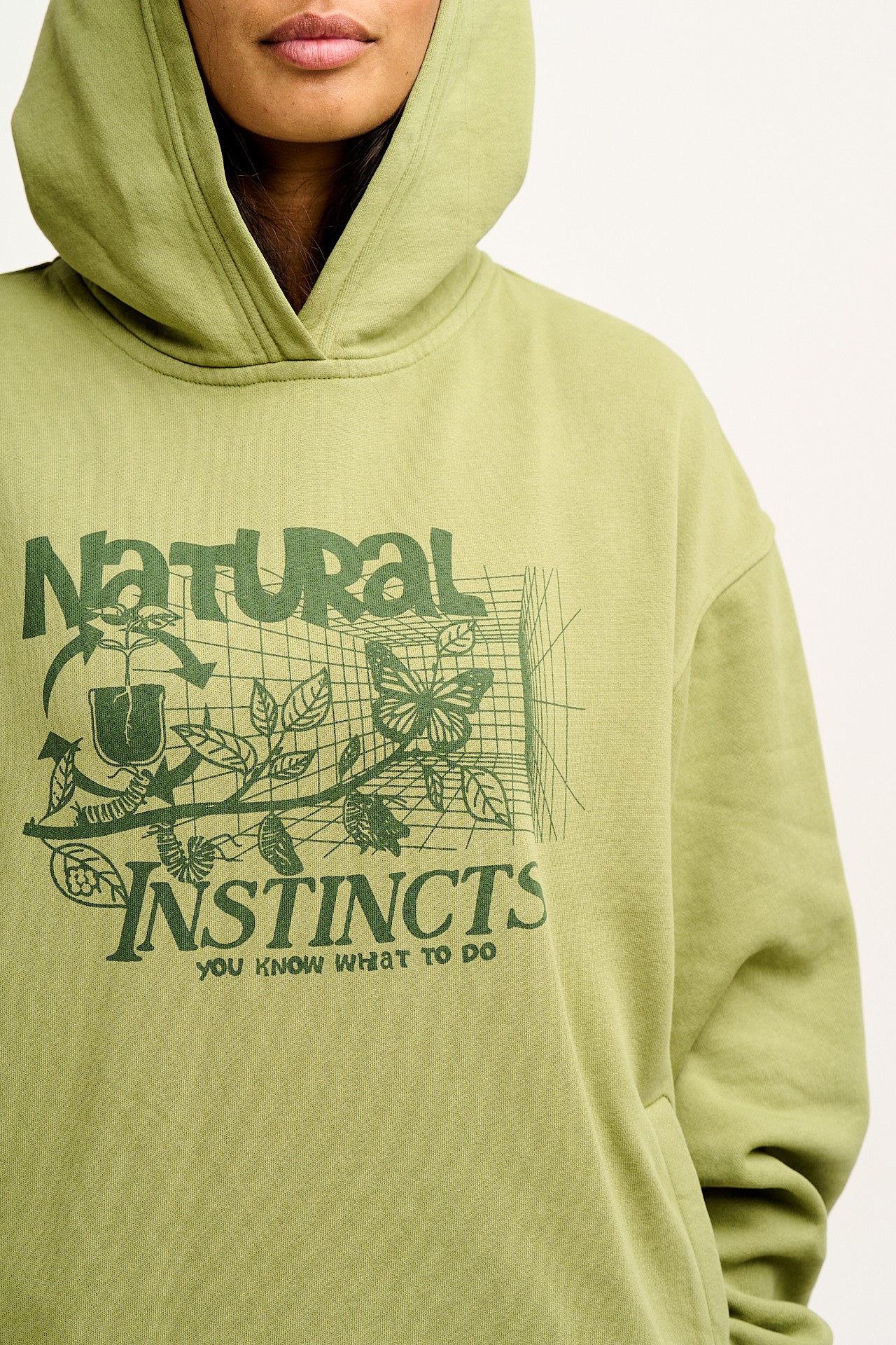 Bailey - Hoodie in Green with Natural Instinct Print